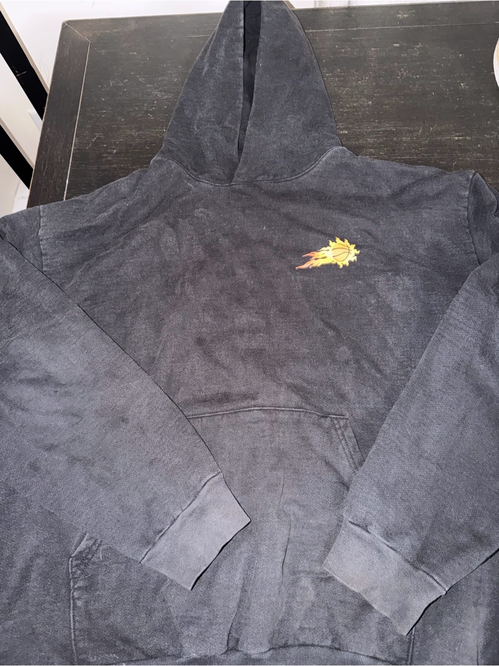 Faded Black Hoodie with Small Flaming Sun Chest Graphic